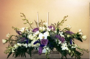 PHILIONOPSIS AND PURPLE ROSE CENTERPIECE  FOR THE HEAD TABLE
