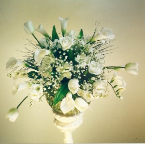 ROSES, LILYS, FREESIA, AND BABY'S BREATH CENTERPIECE